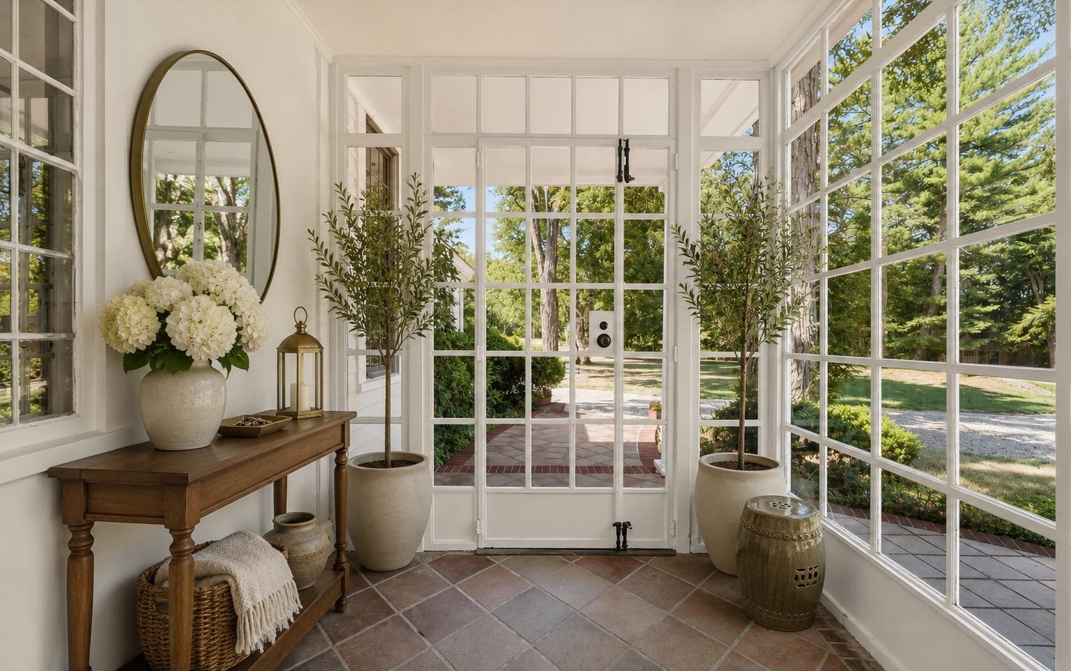 Sunroom entry with French doors opening to the brick patio