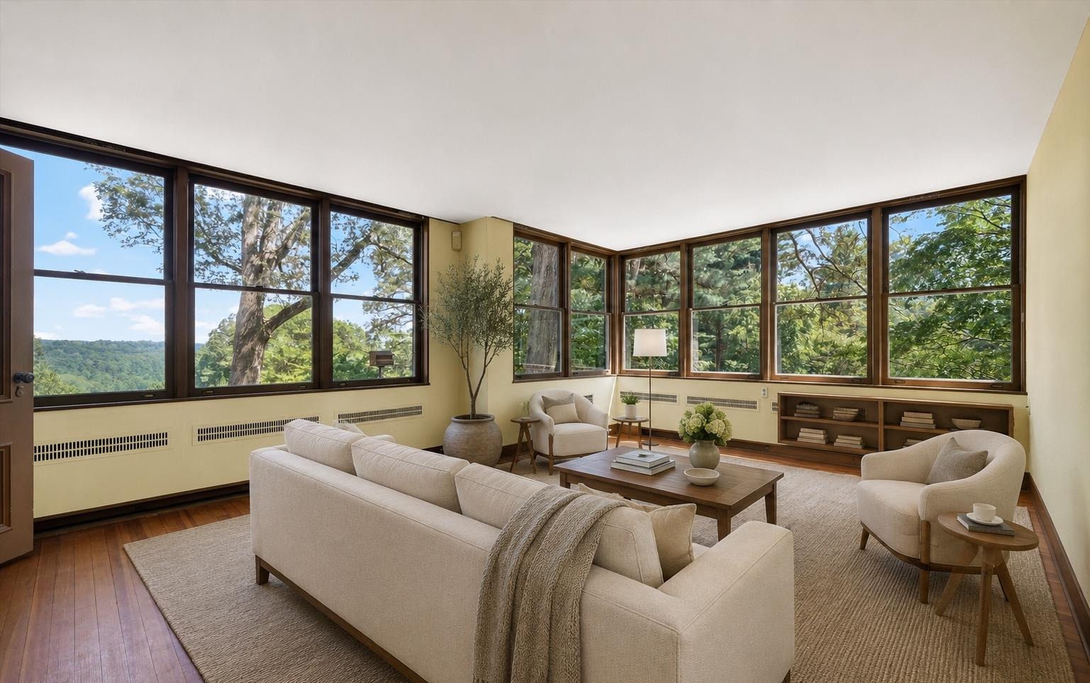 Sunroom lounge with panoramic windows overlooking the reservoir
