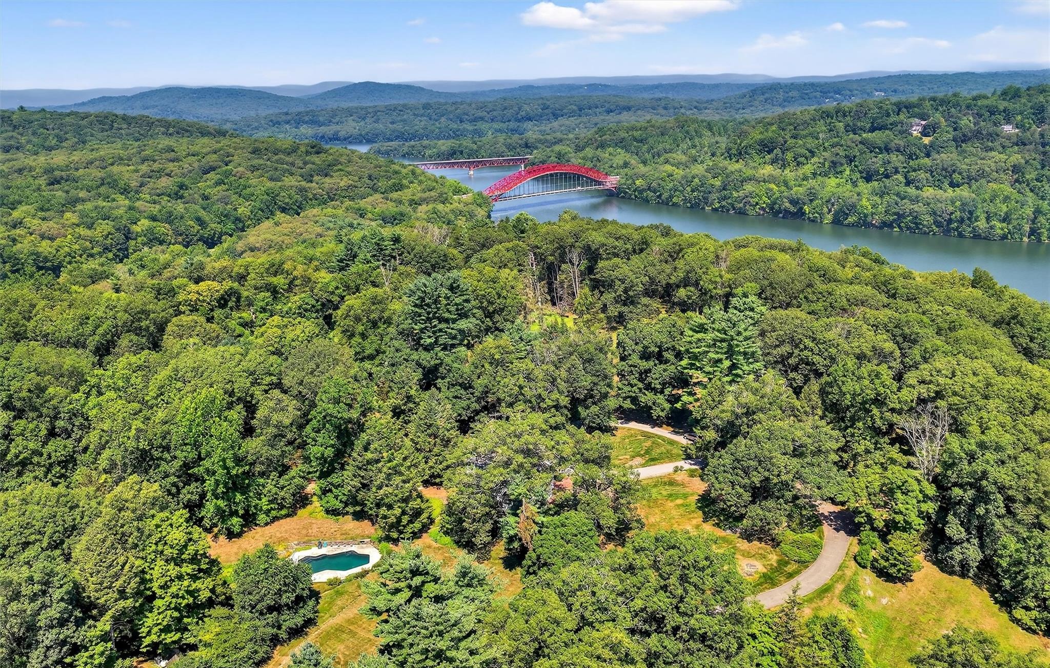Aerial view of the pool, grounds, and Croton Reservoir at Old Dam Farm